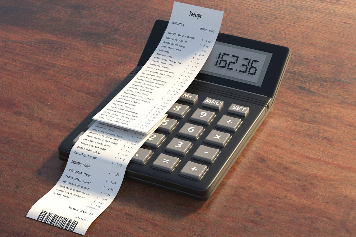 Long receipt on top of a gray calculator
